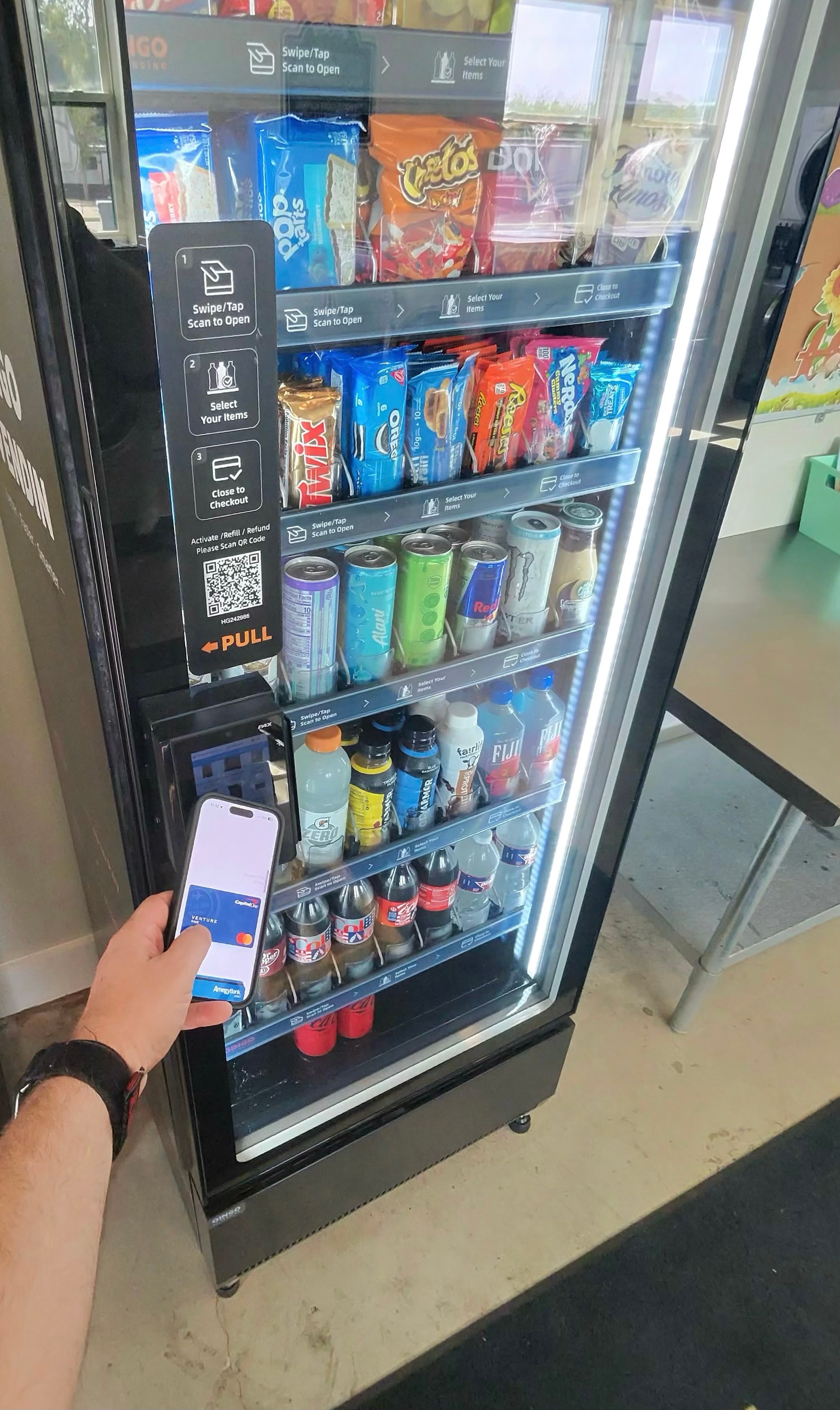 Customer using cashless payment at a Smart Serve smart cooler
